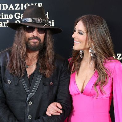 ROME, ITALY - MAY 24: Billy Ray Cyrus and Elizabeth Hurley attend the "Orizzonti | Rosso" Exhibition Opening Dinner at Palazzo Barberini on May 24, 2025 in Rome, Italy. (Photo by Elisabetta A. Villa/Getty Images)