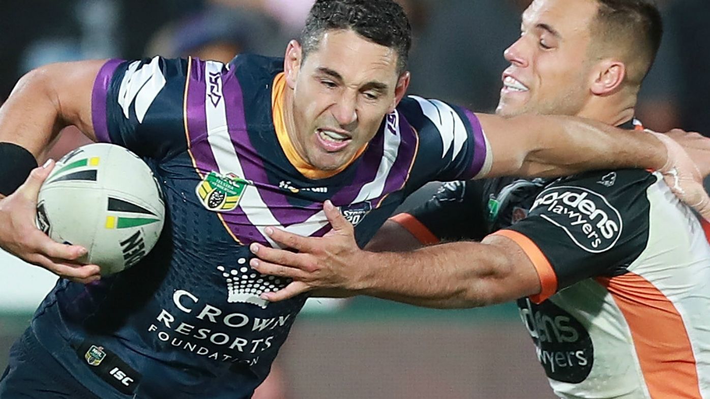 Billy Slater of the Storm is tackled by Luke Brooks of the Wests Tigers during the Round 5 NRL match between the Wests Tigers and the Melbourne Storm at Mt Smart Stadium in Auckland, New Zealand, Saturday, April 7, 2018.