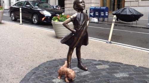 Urinating dog takes on Wall Street's Fearless Girl