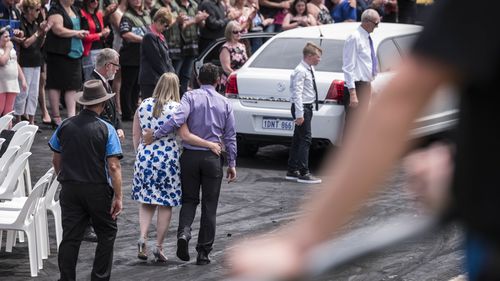 Anita Board's mother Sonja (second left) and father Ian (centre) leave following Anita's funeral at Perth Motorplex. (AAP)