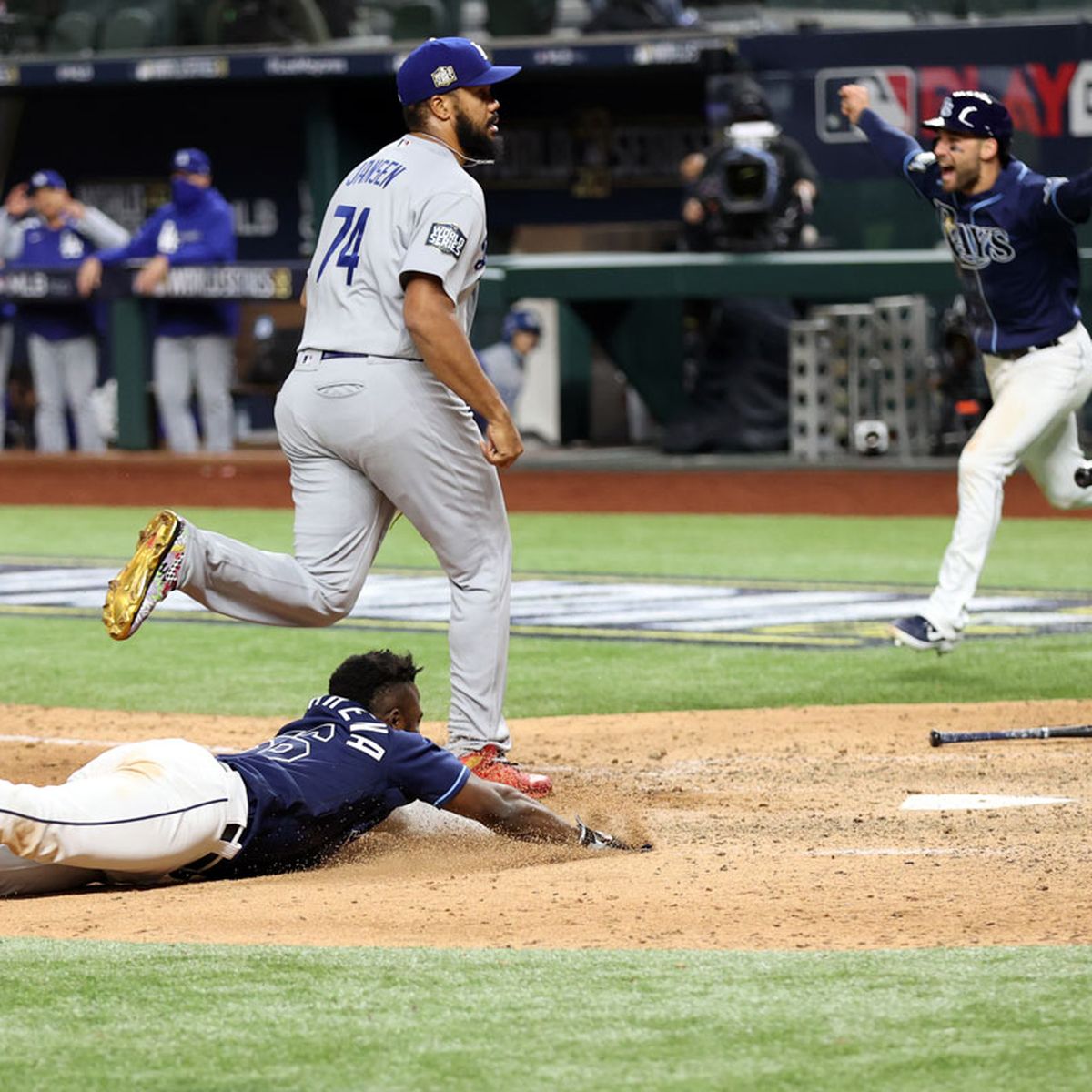 Photos: Randy Arozarena lays on home plate after game-winning run