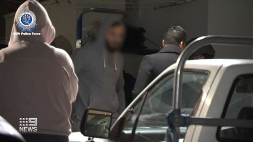 Two men have been charged and police are searching for three more after a woman was allegedly gang-raped in her home in Sydney's south-west.