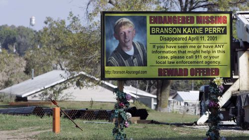 A billboard in Skidmore implores passers-by for help finding Branson Perry.