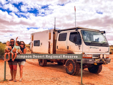 The Zavros family at the Simpson Desert boundary line, thinking their next destination was in just hours.