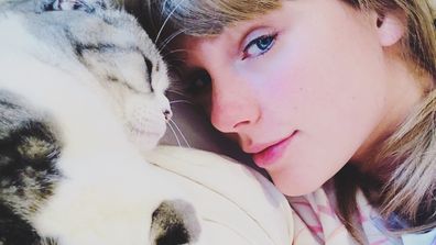 Taylor Swift and her pet cat Olivia Benson.