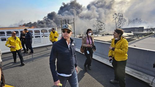 California Governor Gavin Newsom surveys damage in during the Palisades Fire on Wednesday, Jan. 8, 2025, in Pacific Palisades, Calif. (Jeff Gritchen/The Orange County Register via AP)