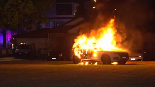 The white Audi was well alight when emergency crews were called to the scene in Five Dock overnight. (9NEWS)