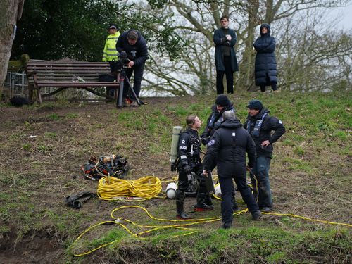 Specialist search teams from Lancashire Police, beside the bench where Nicola Bulley's phone was found, on the banks of the River Wyre, in St Michael's on Wyre, Lancashire.