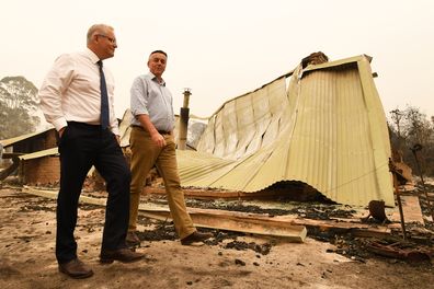 Prime Minister Scott Morrison (L) and Darren Chester MP tour the Wildflower farm owned by Paul and Melissa Churchman on January 3, 2020 in Sarsfield, Victoria, Australia. (Photo by James Ross-Pool/Getty Images) 