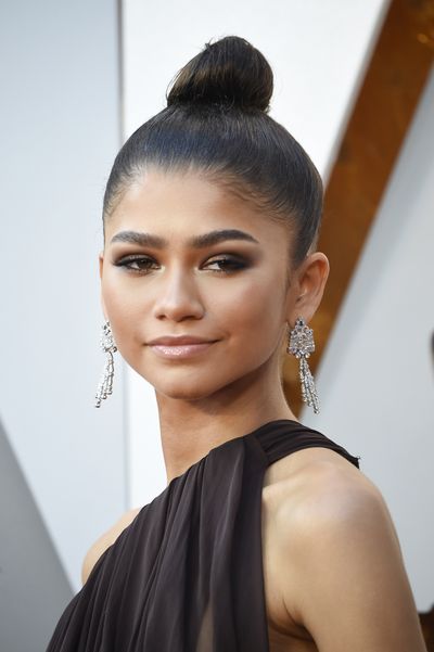 <p>Proving a top-knot isn't just for around the house, Zendaya shows us how to pull of a bun -&nbsp; red-tie style. She paired her sleek hair with a brown smoky eye, bronzed cheek and nude lip. Perfection.&nbsp;</p>