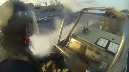 RAN sailors approaching the boat off the east coast of Africa. (Supplied)