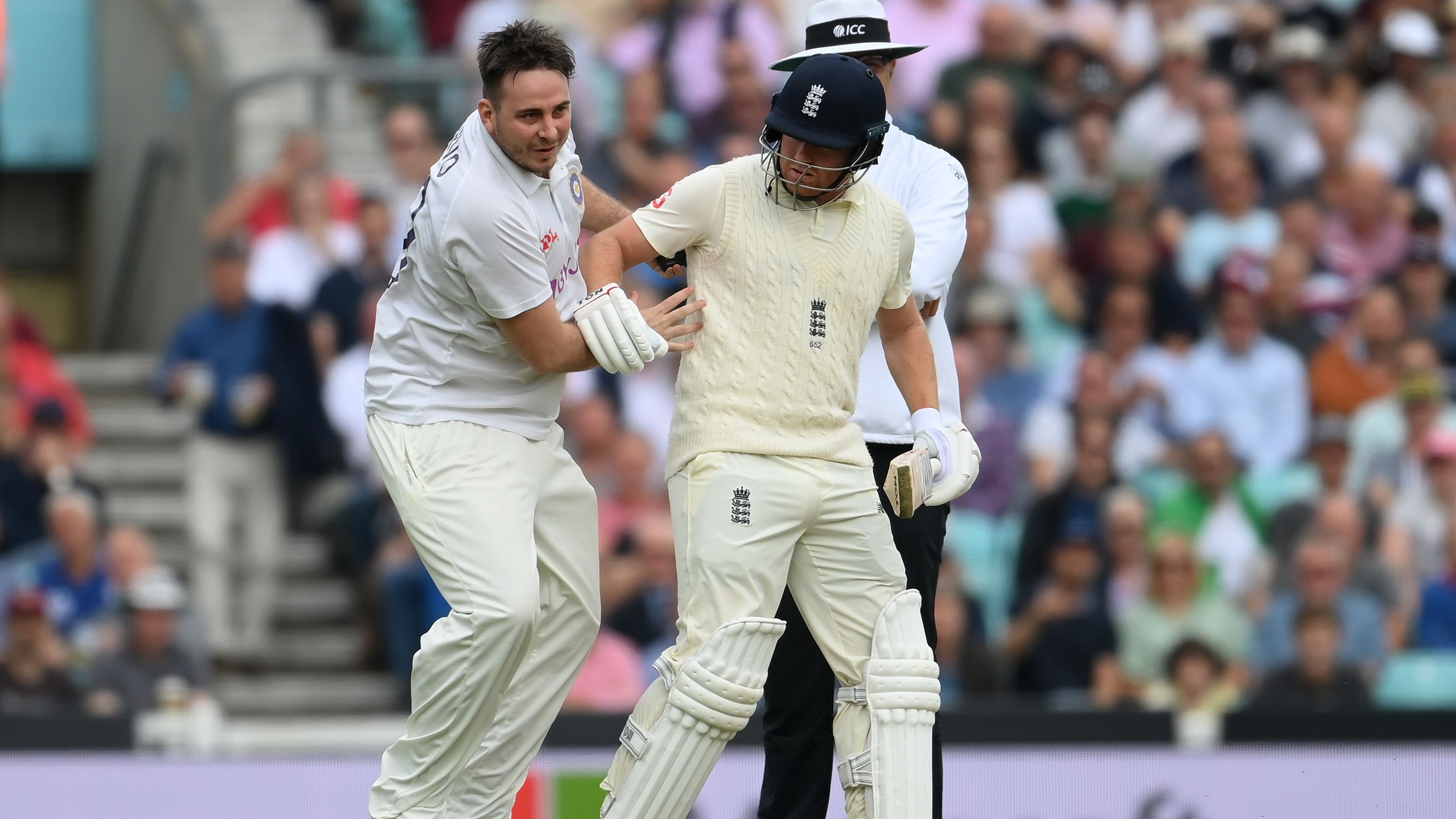 Pitch invader bumps Bairstow in bizarre incident