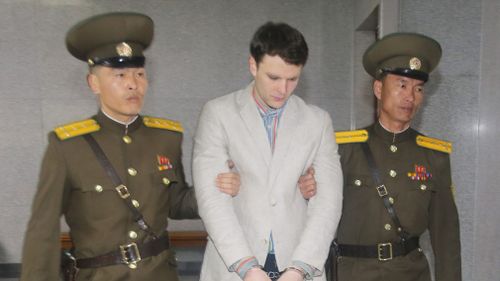 American student Otto Frederick Warmbier (C) arrives at a court for his trial in Pyongyang, on March 16, 2016. (AFP)