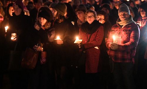 Fire crews used high-pressure hoses to remove the paint and the public vigil went ahead.