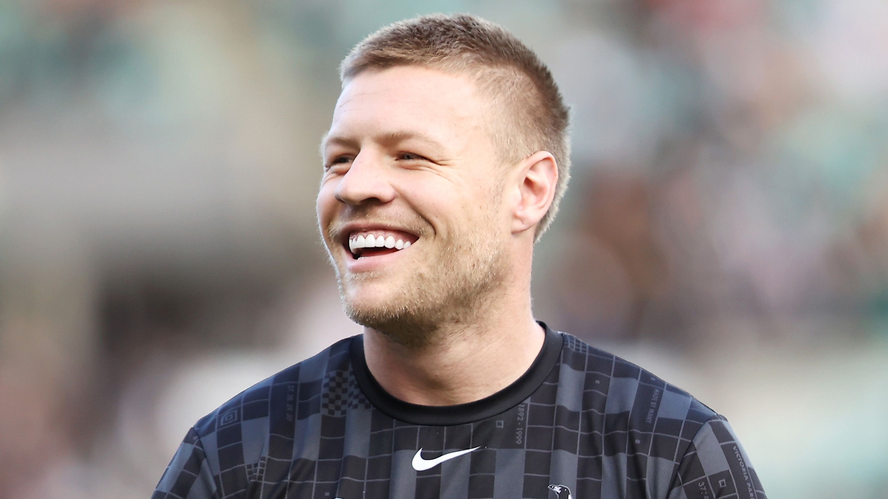 Jordan De Goey of the Magpies shares a laugh with his team mate during the warm-up before the AFL Second Preliminary match between the Sydney Swans and the Collingwood Magpies at Sydney Cricket Ground on September 17, 2022 in Sydney, Australia. (Photo by Mark Kolbe/AFL Photos/via Getty Images)