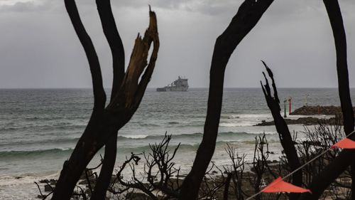 HMAS Choules sits off the coast Mallacoota in Victoria.