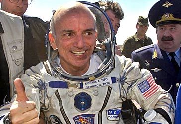 When did Dennis Tito visit the International Space Station as the first space tourist?