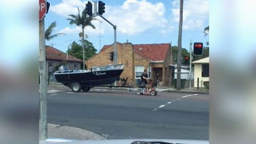 Footage went viral last month showing Shane Swancott riding his mobility scooter down the Pacific Highway with a motorboat in tow.