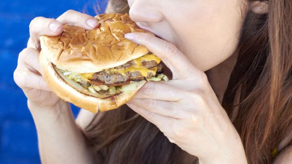 Woman eating burger