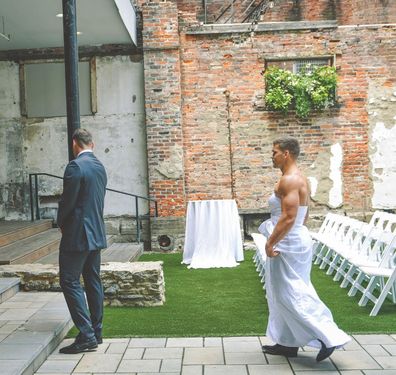 Bride pranks groom with best man wearing a wedding dress