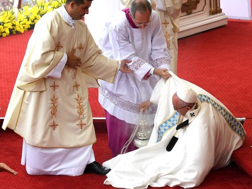 Pope Francis falls during mass in Poland. (AAP)