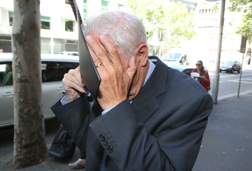 Farrell covered his face outside court last Friday. (AAP)