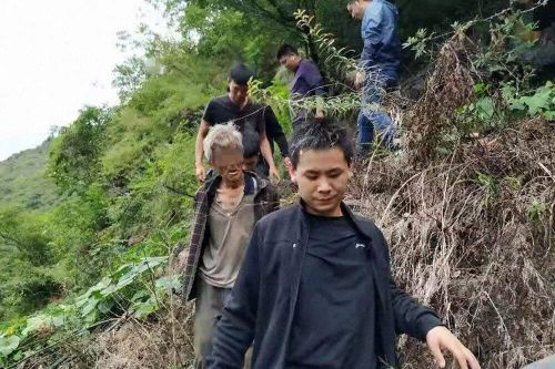 Song Jiang is led down the mountain by Yongshan Police, who captured him after 17 years on the lam.