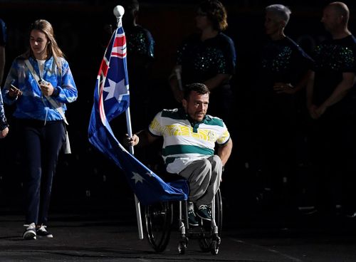 Australian flag bearer Kurt Fearnley received a rousing ovation - but viewers at home missed out on the chance to see him. (AAP)