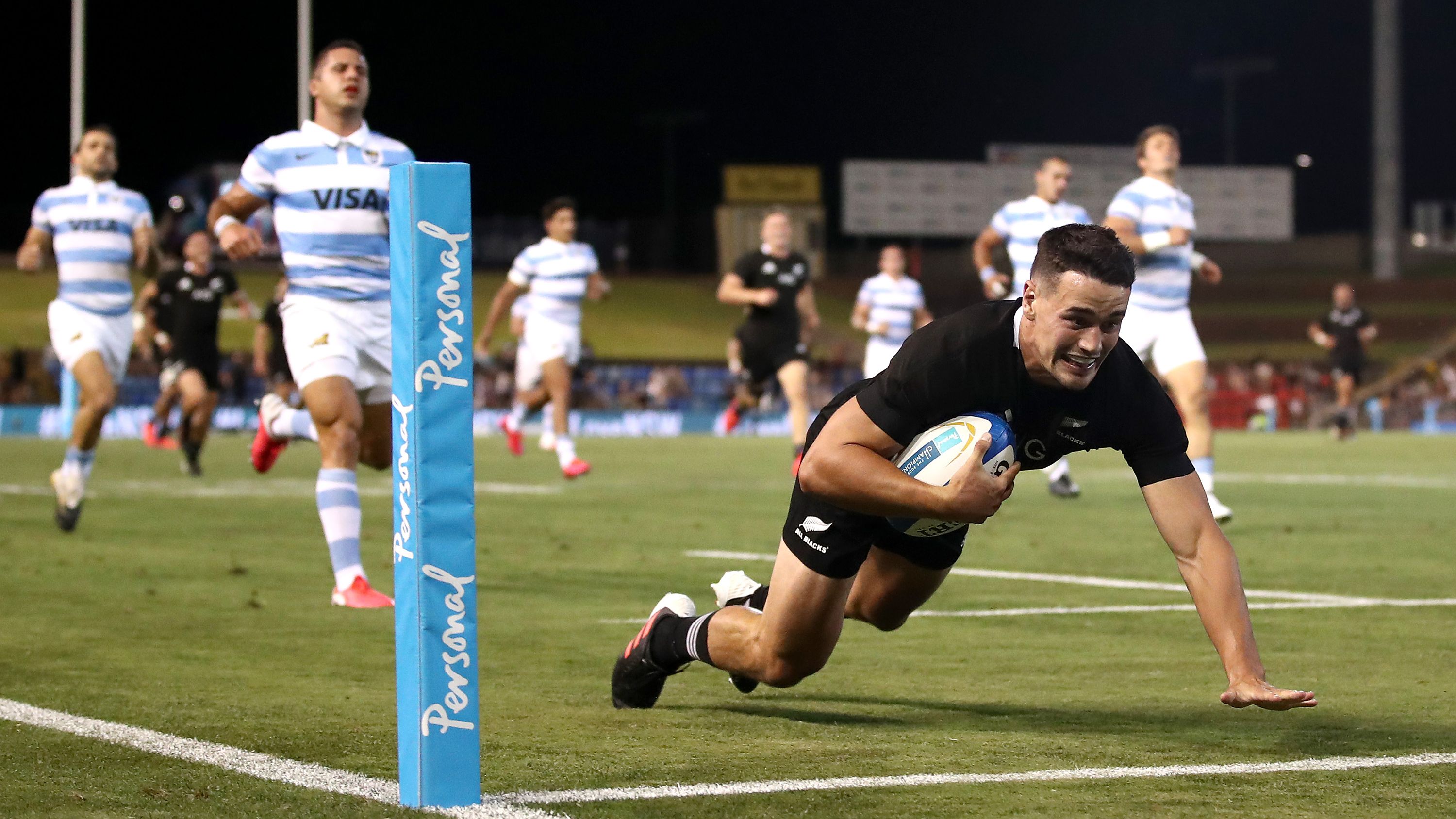 Will Jordan of the All Blacks makes a break to score a try.