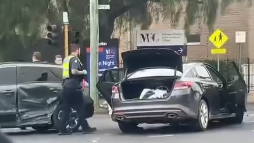 Police were seen taking at least one person from the scene.