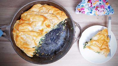 A spinach pie in a pan makes the perfect lazy dinner that still looks so good