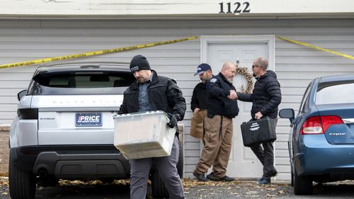 Officers investigate the deaths of four University of Idaho students at an apartment complex south of campus on Monday, November 14, 2022, in Moscow, Idaho. 