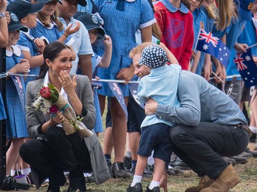 He then went over to give Meghan a hug too.