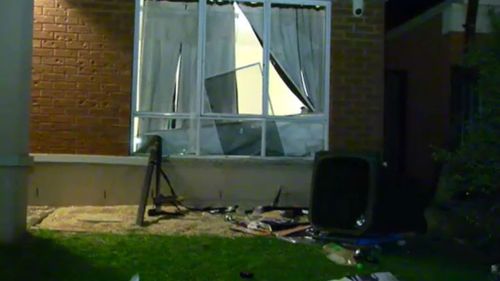 The gatecrashers the front windows of the property. (9NEWS)