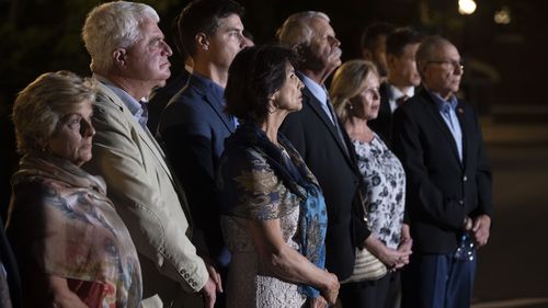 Family members of American citizens killed in Syria by members of an Islamic State group, stand attended a hearing at the U.S. Court House in Alexandria. 