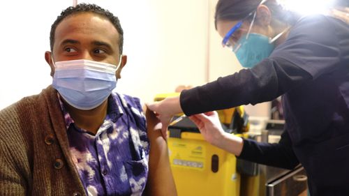 Abiy Gebeyehu who become the millionth fully vaccinated person in Victoria, at the Royal Exhibition Building Vaccination Hub in Melbourne in July, 2021.