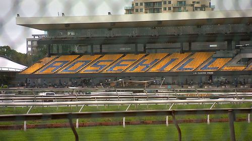 A man caught carrying a sawn-off shotgun near Rosehill Racecourse was not targeting patrons, police have confirmed. (9NEWS)
