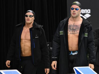 Cody Simpson and Kyle Chalmers of Australia walk out to compete in the men's 100m butterfly.