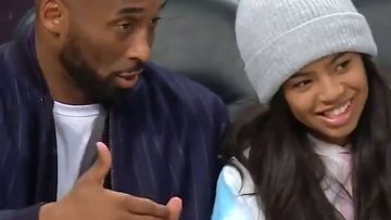 Kobe Bryant gives daughter Gianna some courtside tips at a game in December.