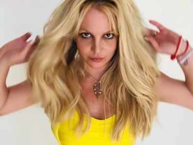 Britney Spears celebrates newfound freedom from conservatorship by donning a yellow dress in an Instagram post