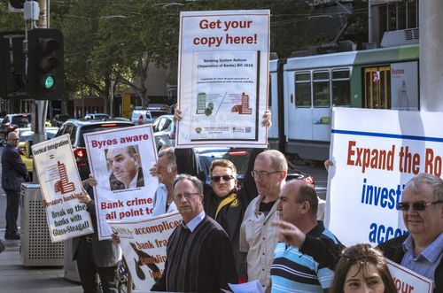 Protesters rally outside the Commonwealth Law Courts Building in Melbourne on Monday. (AAP)