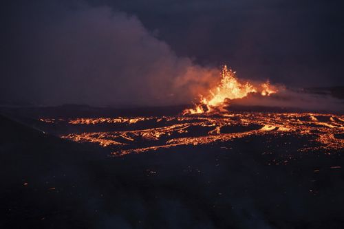 Lava emerges from a fissure of the Fagradalsfjall volcano near the Litli-Hrútur mountain, some 30 kilometres southwest of Reykjavik, Iceland, Monday July 10, 2023.  