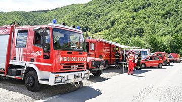Special firefighter teams engaged in the search for the missing helicopter with seven people on board between Tuscan Emilian Apennines and Garfagnana, on June 10, 2022 in Pievepelago, Italy. 