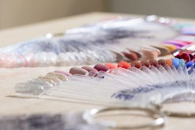 False nail sample sticks for demonstration in beauty salon. 