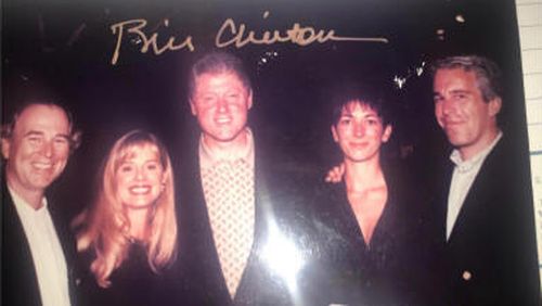This undated photo released by Democrats on the House Oversight Committee shows former President Bill Clinton, Ghislaine Maxwell and Jeffrey Epstein, with Clinton's signature at the top of the photo.