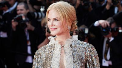 Nicole Kidman walks the red carpet at the Cannes Film Festival 2017 wearing a silver sequined dress with matching metalic heels.