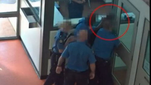 Another incident investigated by the CCC shows a guard attacking an already-secured inmate, unleashing pepper spray just centimetres from his face. Picture: 9NEWS