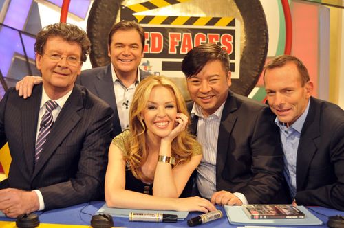 Kylie Minogue (centre) with Red Symons, host Daryl Somers, Entourage actor Rex Lee and former prime minister Tony Abbott. (AAP)