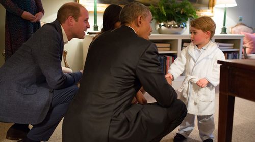 Barrack Obama and Prince George in his dressing gown. (AAP)