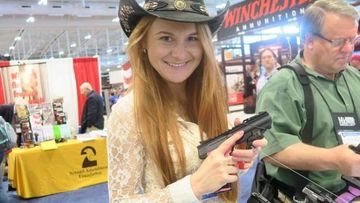 Mariia Butina poses with a pistol at a gun show. (Facebook)